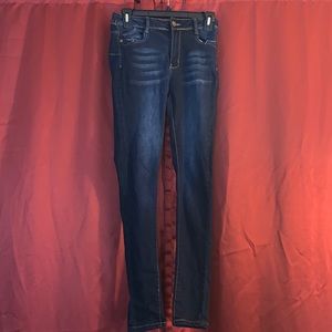 Dark wash mid rise skinny jeans